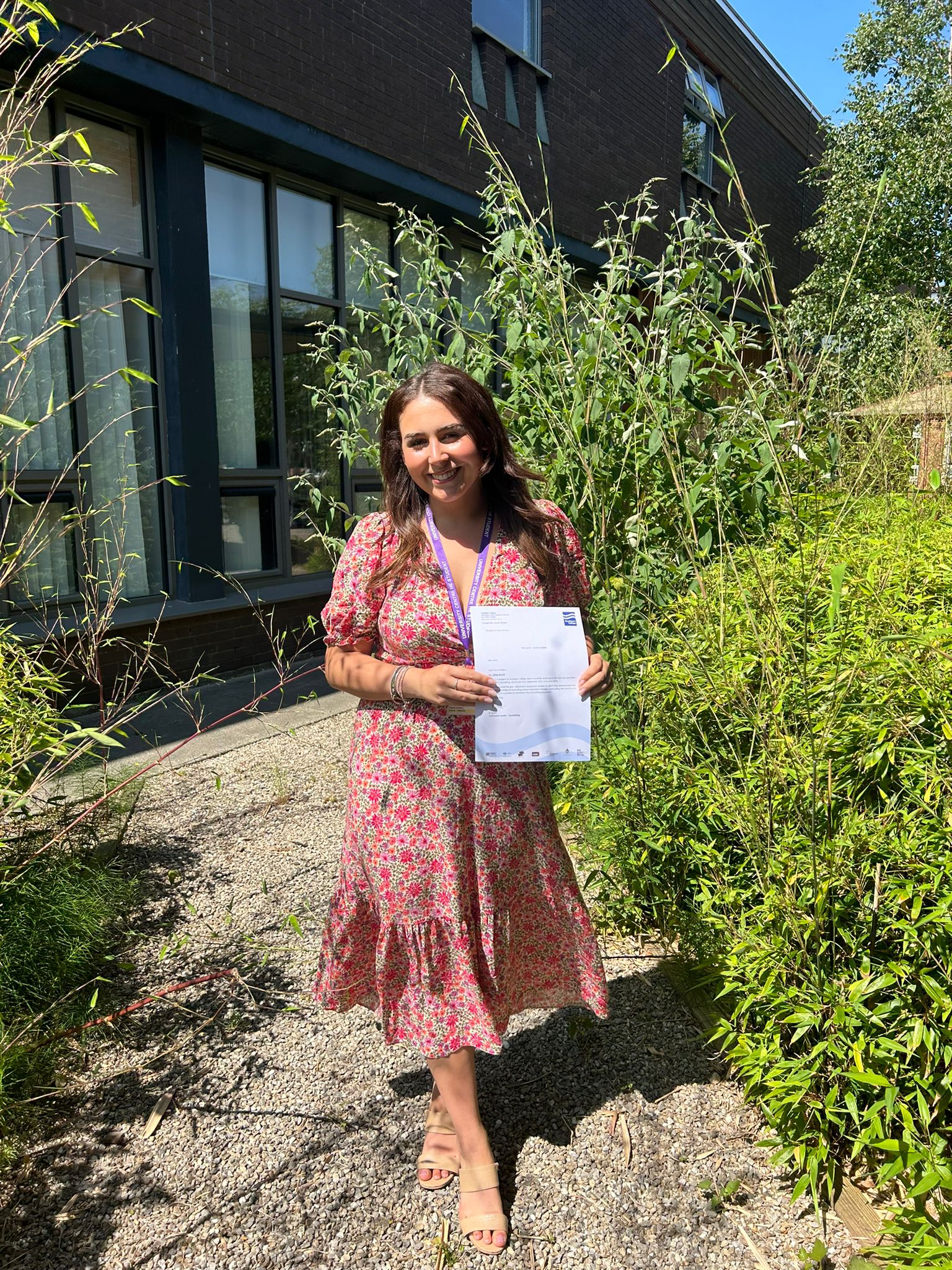 Chloe Burrill, qualified counsellor and therapist at Therapy with Chloe, with her college certificate.